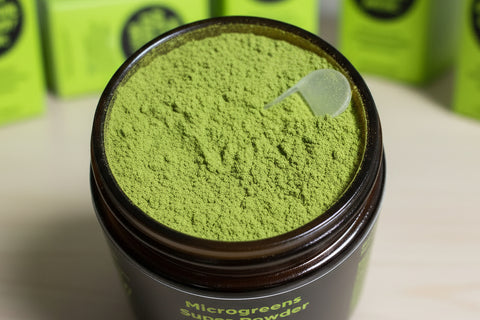 Top view in jar of green fresh microgreens super powder with a scoop inside by Eat Your Greens Organic Farm in Austin Texas